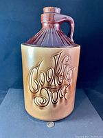 Front view of the vintage ceramic cookie jug cookie jar showing raised 'Cookie Jug' letters and two-tone glaze.