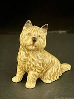 Front view of the Wade Cairn Terrier ceramic figurine showing detailed fur texture and face.