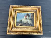 Full view of painting in ornate gilded frame