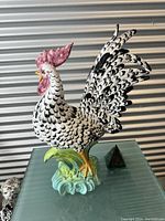 Side view of ceramic rooster showing full profile and base