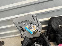 Gray backpack style pet luggage bag with Mobile Dog Gear branding and tag attached