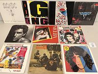 Front covers of 11 vinyl records arranged in three rows, showing album art and titles.