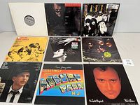 Front covers of nine vinyl records arranged in two rows showing album art and titles, including Bangles, Bee Gees, Kinks, Springsteen, Phil Collins and others.