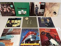 Front view of all 10 vinyl album covers showing artwork for each record.