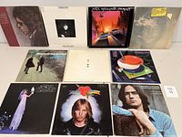 Front side view of all 11 vinyl record albums showing cover art and titles in a grid arrangement