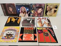 Front view of vinyl record album covers including Grace Slick, Frampton Comes Alive, Culture Club, Edgar Winter, Lou Reed, Brian Setzer, The Tubes, Beatles, Henry Jerome, Patrick Crowley, and a compilation.