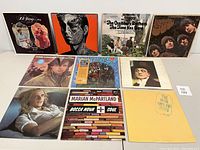 Front view of 10 vinyl album covers showing various artists including Rudolph Friml, Rolling Stones, Chamber Brothers, Beatles, John Cougar, Creedence Clearwater Revival, Face, Andy Pratt, Marian McPartland, The Who.