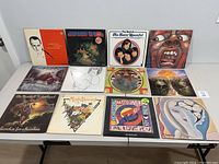 Front view of 12 album covers showing varied artwork and artists