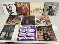 Front view of 10 vinyl album covers arranged in 2 rows, showing various artists and titles.