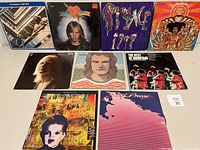 Front covers of nine vinyl albums showing varied artwork and condition
