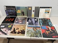 Front cover view of all 12 vinyl albums laid out in two rows showing front artwork and titles.