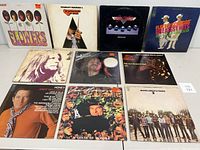 Front view of 10 vinyl record albums showing various artists and titles