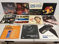 All 12 vinyl albums front covers displayed on table in 3 rows, showing album artwork and titles.