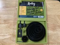 Radley 16-piece hole saw set in lime green plastic case, viewed closed from top