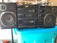 Sony CFD-454 boombox with speakers, front angle showing radio tuner, cassette, and CD decks.