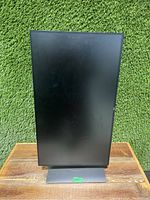 Dell 27-inch monitor in portrait orientation showing front view and adjustable stand base.