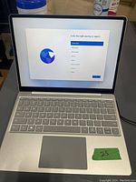 Open laptop showing setup screen and keyboard