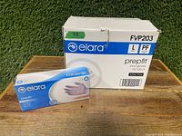 White and blue Elara Prepfit vinyl gloves box with case box behind it, labeled FVP203 large size powder-free latex-free gloves.