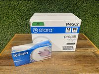 Photo of one sealed individual box of Elara Prepfits vinyl gloves in medium size, placed next to a sealed case box.
