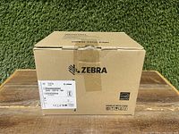 Sealed cardboard box with Zebra logo and part number label on front