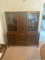 Front view of assembled two-piece china cabinet