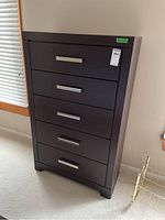 Front view of dresser showing five drawers and metal handles