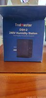 Blue retail box labeled 'TrolMaster DSH-2 240V Humidity Station' with plug image on front.