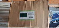 Box of new in box privacy screen fence with label showing product is green mesh screen for privacy fencing, marked as made in China.