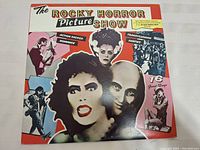 Front cover of The Rocky Horror Picture Show vinyl soundtrack showing stylized images of characters and promotional text.