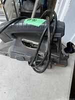 Photo of Black & Decker 3/4 inch electric planer showing the handle, power cord wrapped around, and labeling on the body.