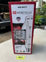 Box of EYE Hortilux 600 watt Ceramic HPS grow light bulb showing branding, wattage, and technology details