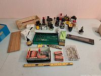 Overview of entire lot on table showing inks, nibs, drafting tools and boxes