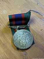 Front view of the WW2 Canadian Volunteer Service Medal showing soldiers and inscription.