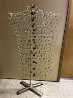 Full front view of the wire dress form on metal stand showing the overall shape, wire pattern, and base.