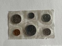 Obverse side of 1979 Canadian proof coin set sealed in plastic with six coins