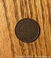 View of the reverse side showing denomination and date with decorative border.