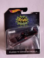 Front view of the sealed Hot Wheels Classic TV Series Batman Batmobile packaging showing the toy car inside.