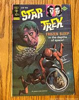 Front cover of Star Trek comic book issue 39 featuring sci-fi artwork and title