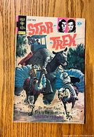 Front cover of Star Trek comic book issue #44 showing main illustration and title.