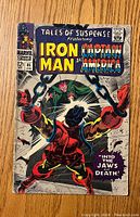 Front cover of Tales of Suspense #85 comic book featuring Iron Man and Captain America with price 12 cents and cover art showing Iron Man struggling in chains.