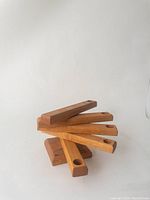 Wooden swivel 5-place candle holder with arms fanned out