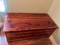Top view of closed cedar chest showing wood grain and finish.