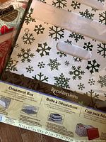 Photo of front of ornament organizer box showing snowflake design and carrying handle