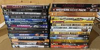 Stack of DVDs including collections and individual titles relevant to Western movies and family classics.