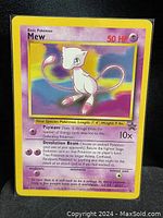 Photo of 1995 Mew Pokémon card #151 with visible front artwork and text.