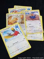 Photo showing four Pokémon Trading Cards including Linoone, Herdier, Lopunny, and Fletchinder, arranged in an overlapping manner.