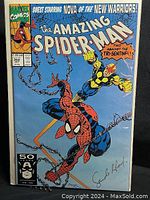 Front cover of 1991 Marvel Comics The Amazing Spider-Man Issue #352 showing Spider-Man and Nova, featuring autograph at the bottom right.