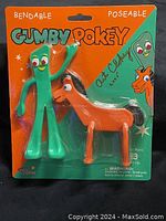 Front view of the original packaging containing Gumby (green) and Pokey (orange) bendable and poseable figurines, both visible inside the plastic bubble.