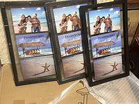 Three black triple photo frames stacked and displayed upright, each holding three placeholder photos of a beach scene with a starfish.