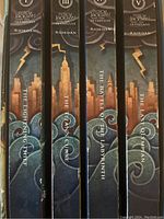 Spines of the five Percy Jackson books showing titles and author Rick Riordan